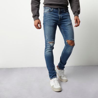 Blue wash ripped Sid skinny jeans